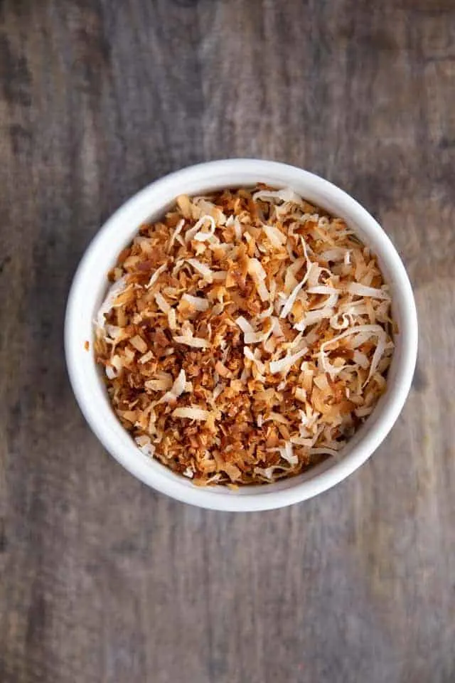 stovetop toasted coconut in a white bowl