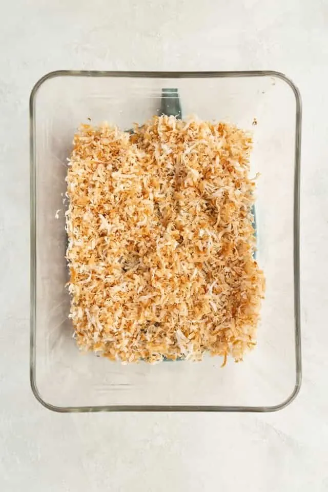 toasted coconut in a glass dish