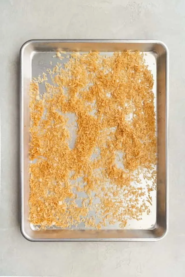 toasted coconut on a baking sheet