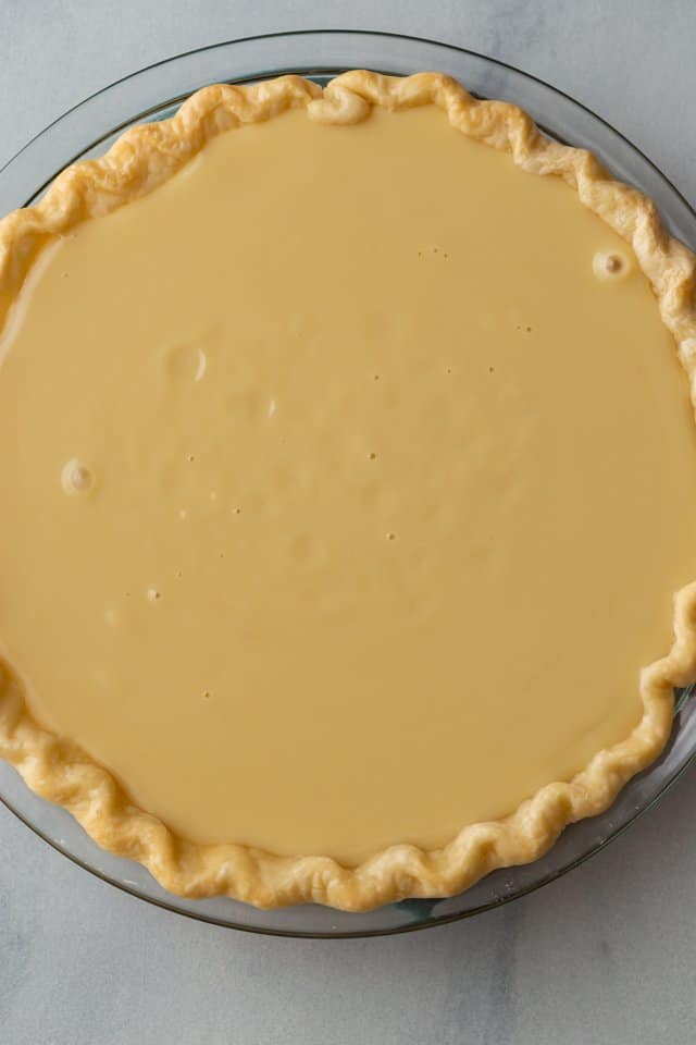 overhead view of unbaked honey pie