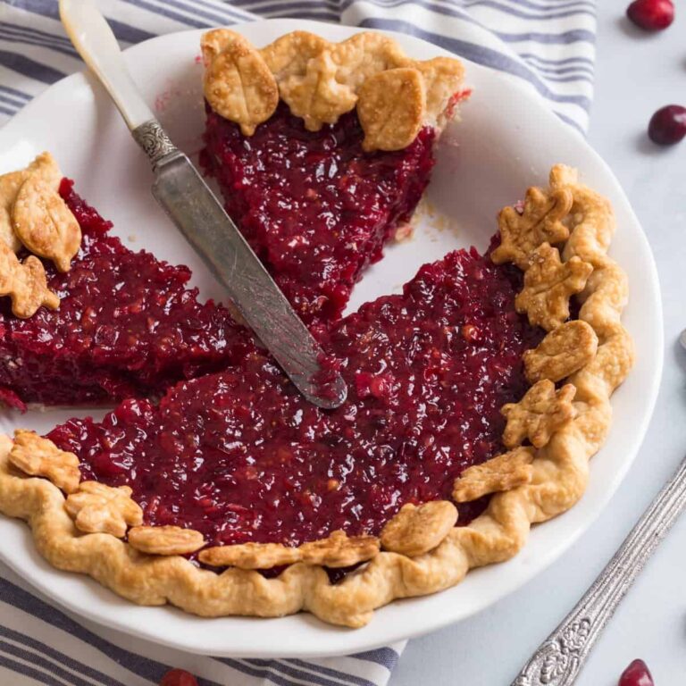 high angled view of a cranberry pie with slices taken out