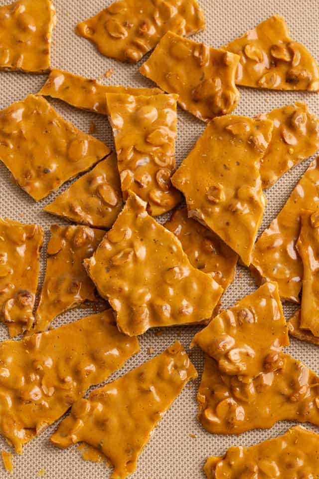 peanut brittle scattered over silicone mat