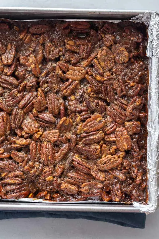 overhead view of pecan pie bars in a baking pan