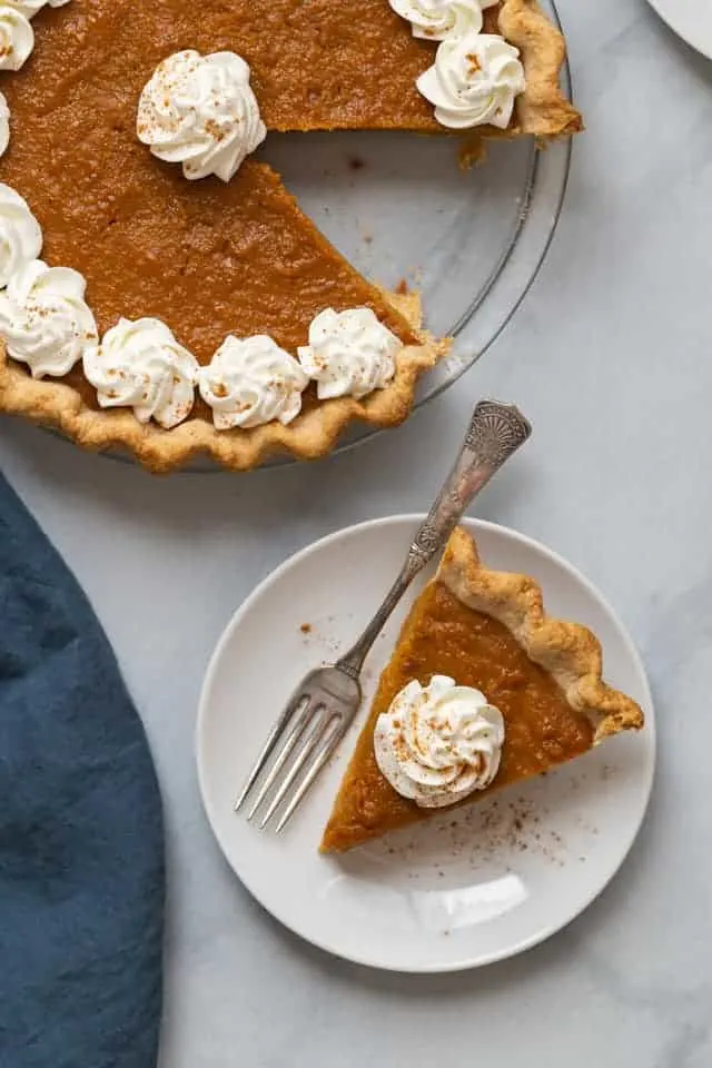 overhead view of a sweet potato pie with a slice taken out