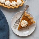 overhead view of a sweet potato pie with a slice taken out