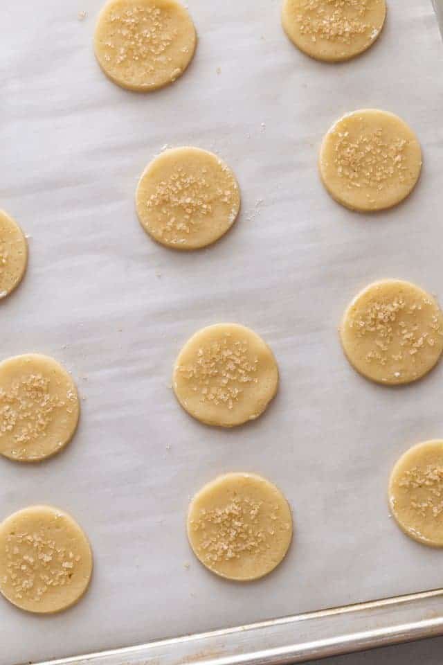 overhead view of unbaked basic butter cookies on a baking sheet