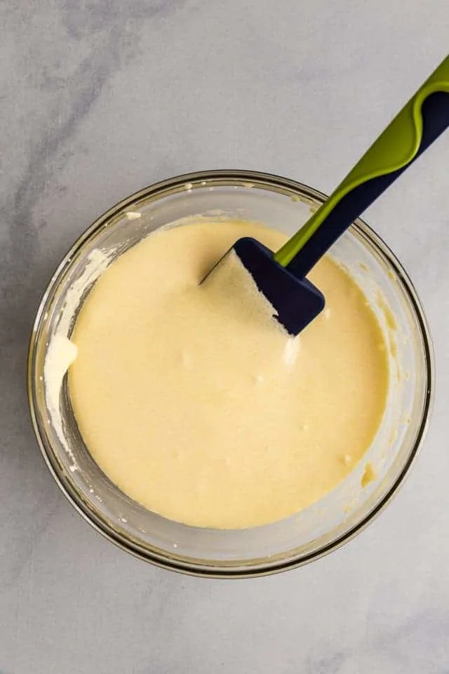 whipped egg yolks and sugar in a glass bowl