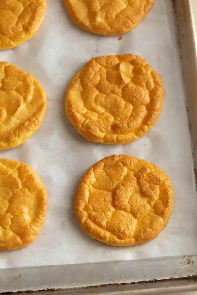 Keto cloud bread on baking sheet wit parchment paper