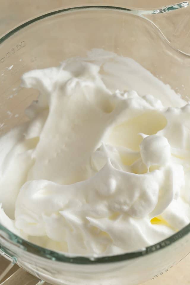 whipped eggs whites in glass bowl