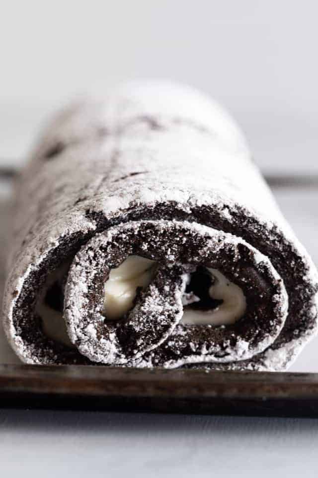 chocolate cake roll filled with white frosting