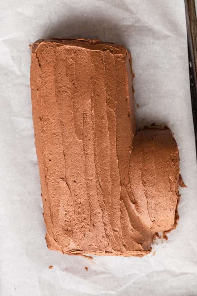 yule log cake covered in chocolate frosting
