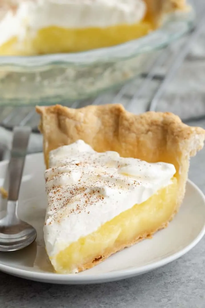 slice of vinegar pie on a white plate with fork