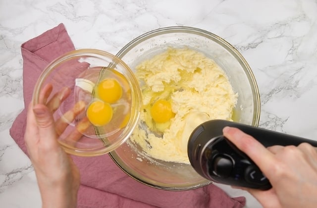 eggs being mixed into cake batter