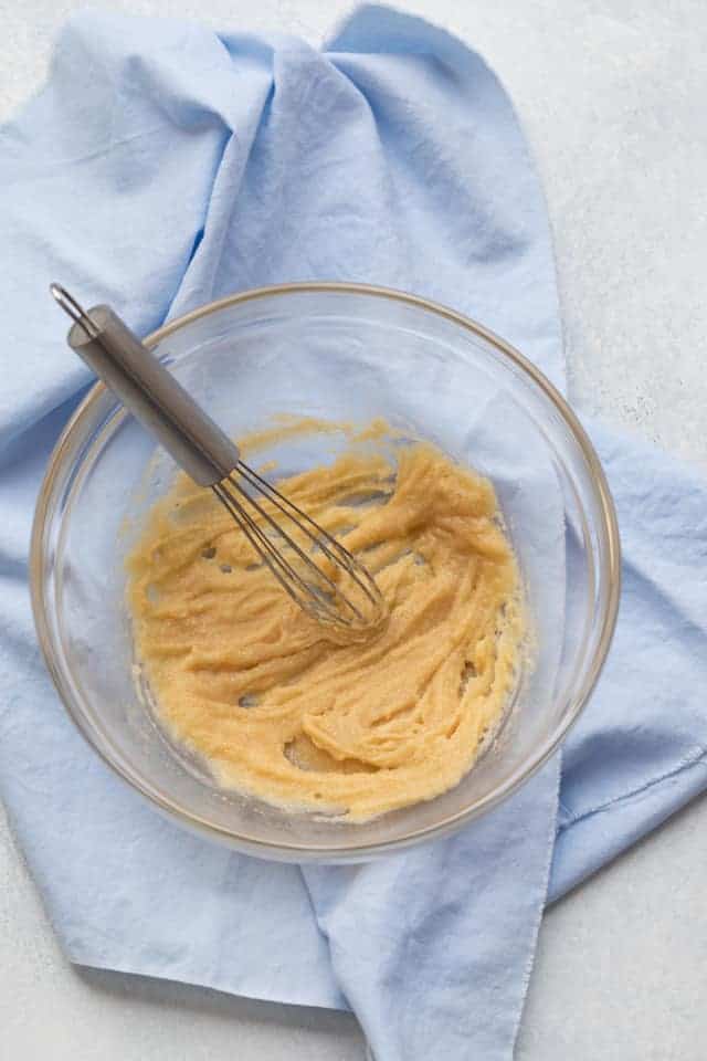 butter and sugar whisked in a glass bowl