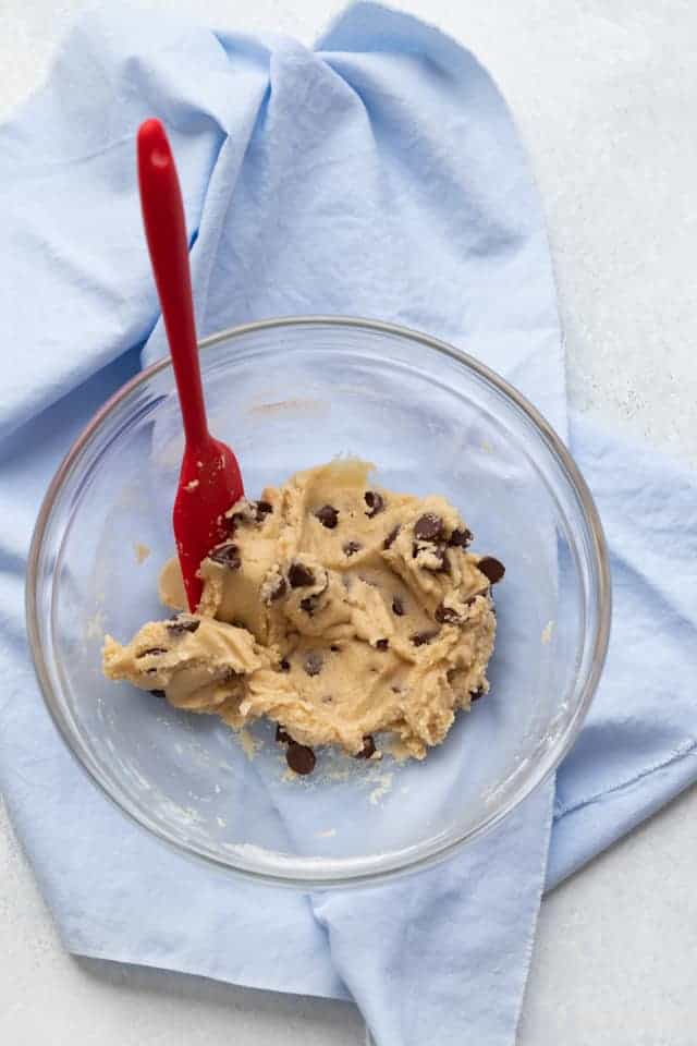 chocolate chip cookie dough mixed in a glass bowl