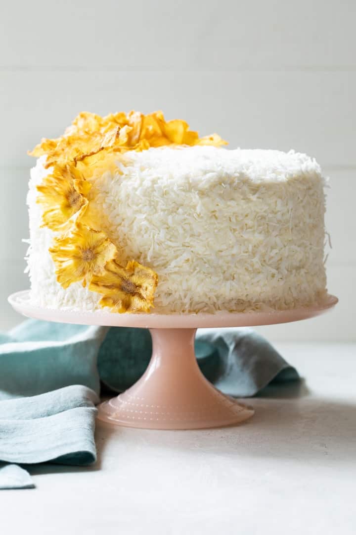 pineapple coconut cake garnished with pineapple flowers