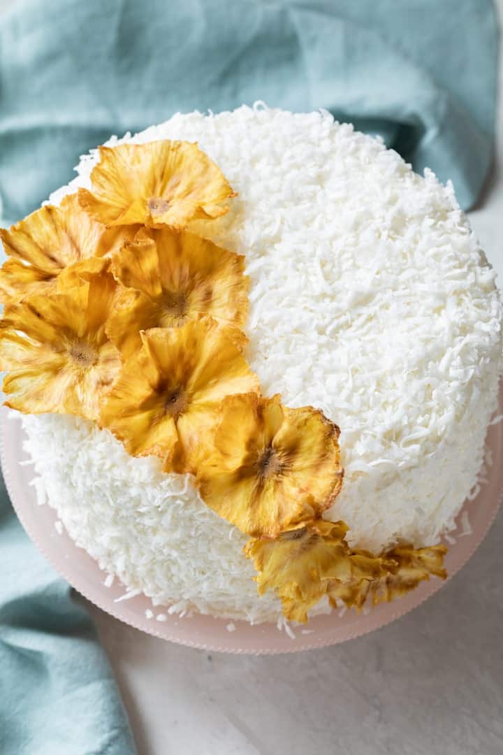 close up of pineapple flowers on pineapple coconut cake