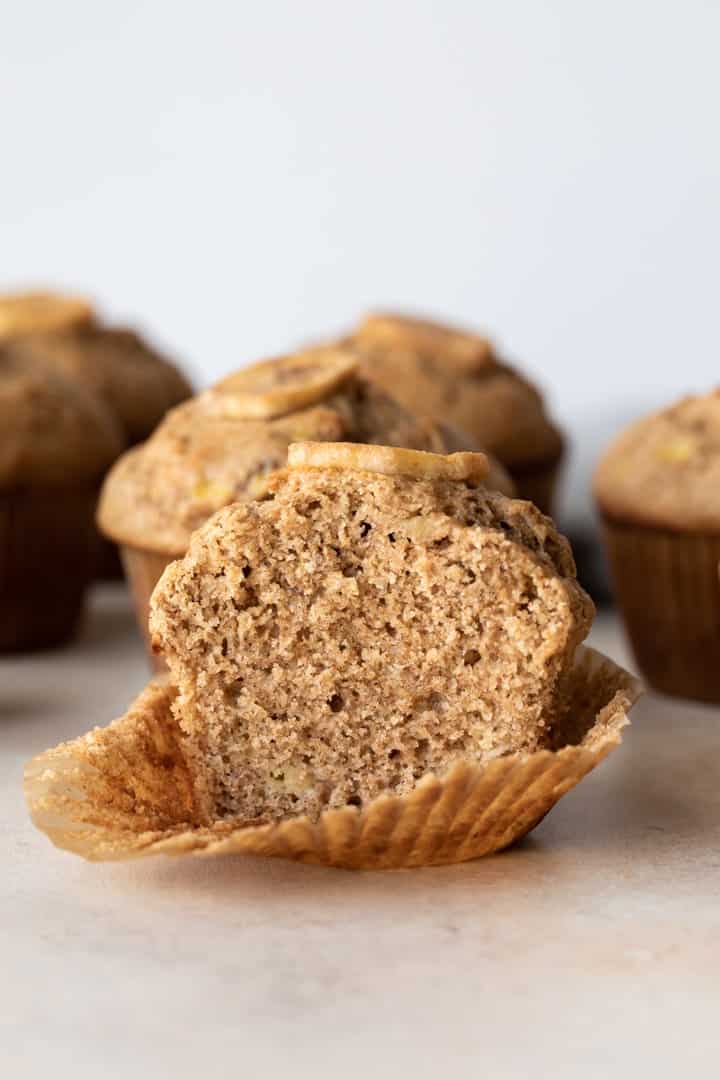 whole wheat banana muffin sliced in half so the inside is visible