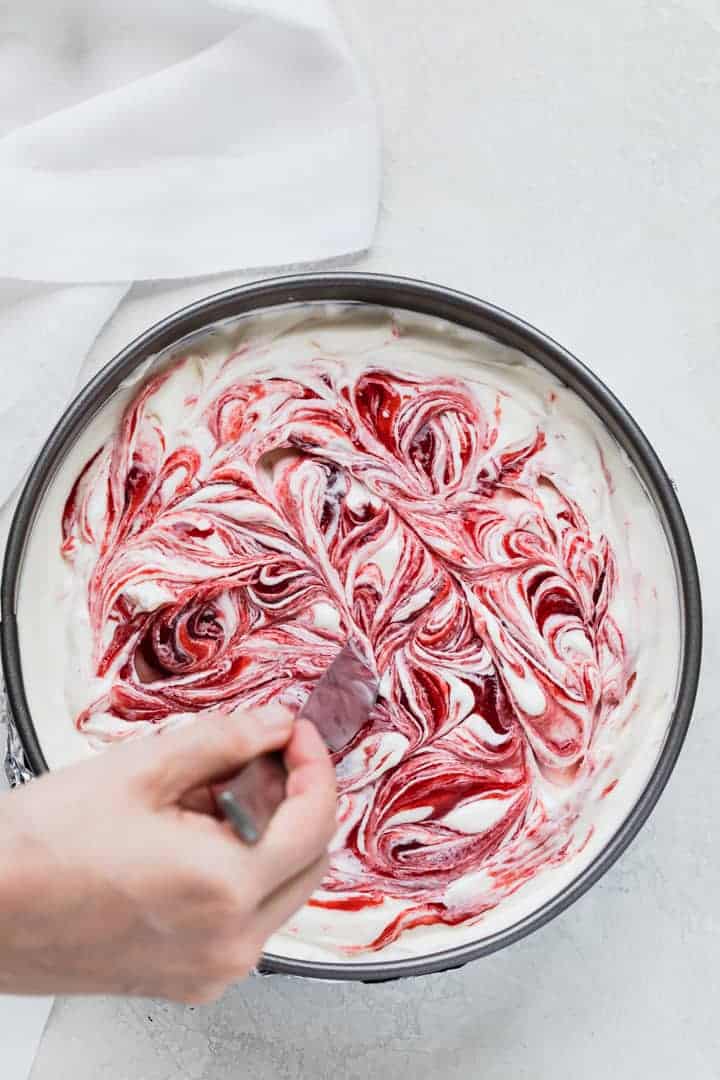 strawberry jam swirled into cheesecake
