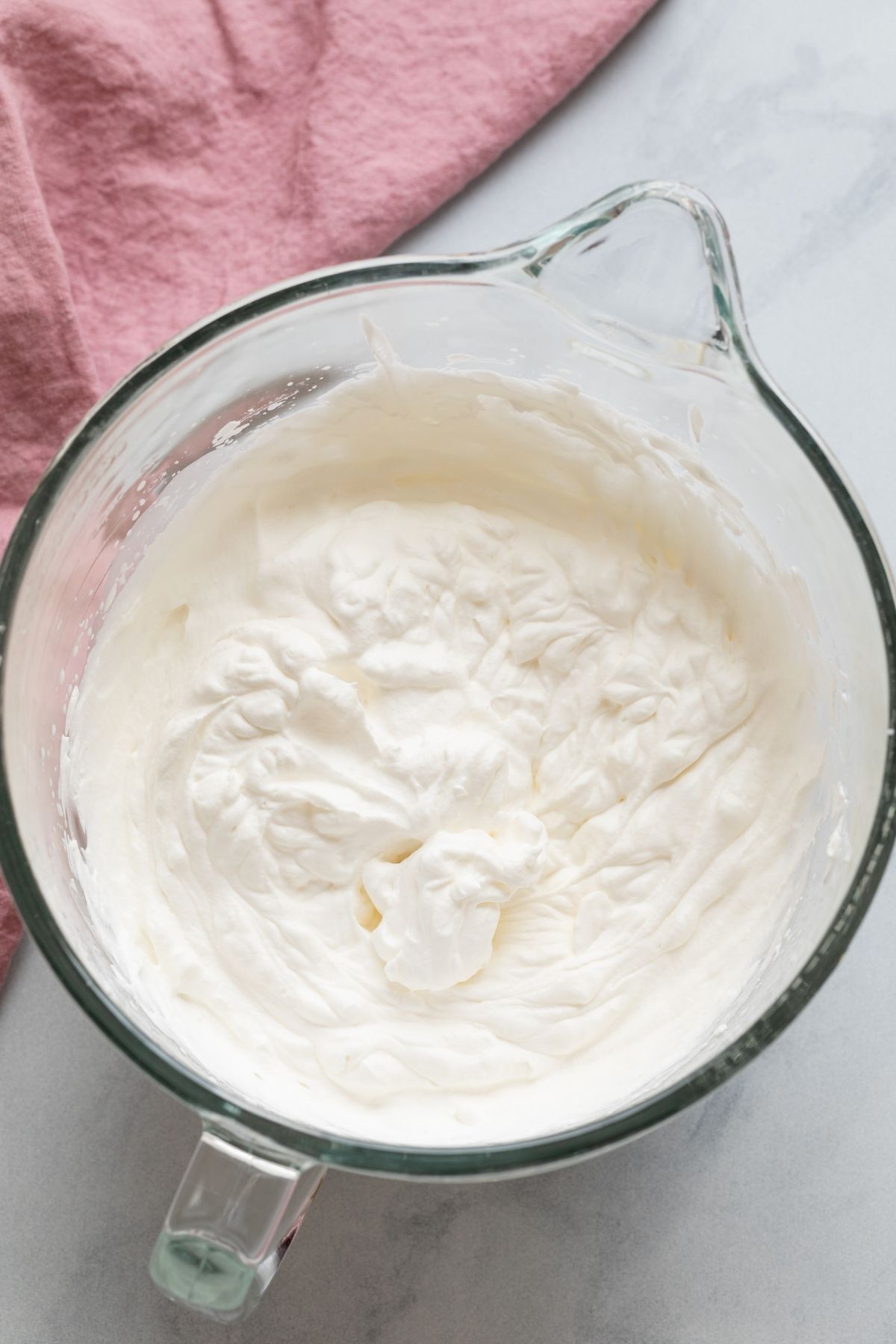 whipped cream in glass bowl