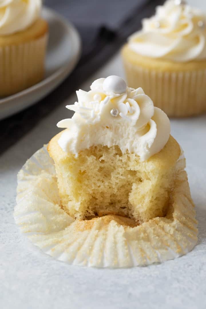 vanilla cupcake with a bite taken out