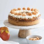 apple pie cheesecake on a marble cake stand