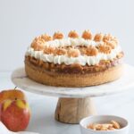 apple pie cheesecake on a marble cake stand
