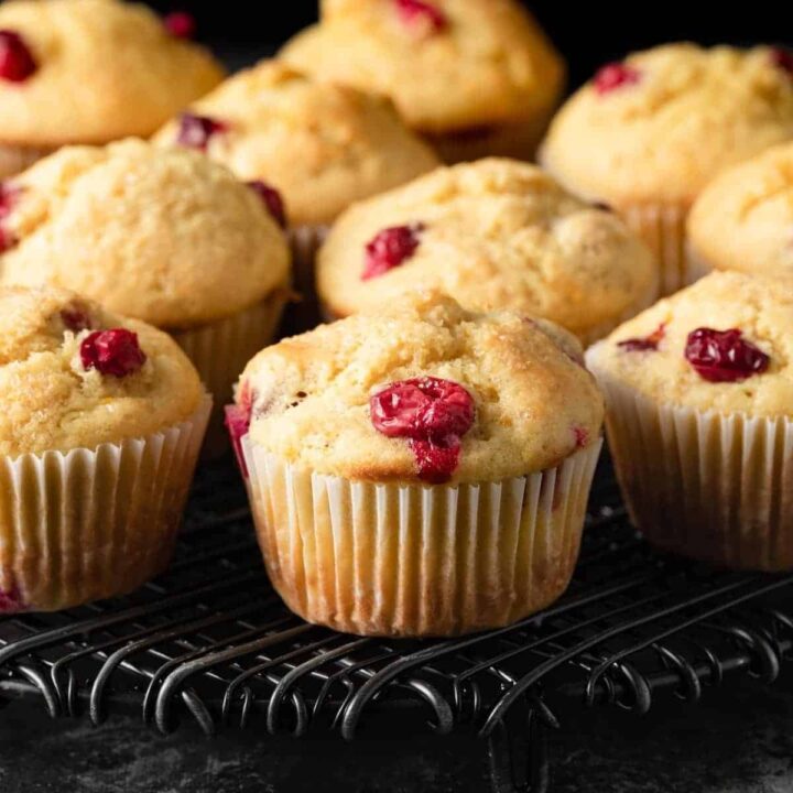 cranberry orange muffins on a cooling rack