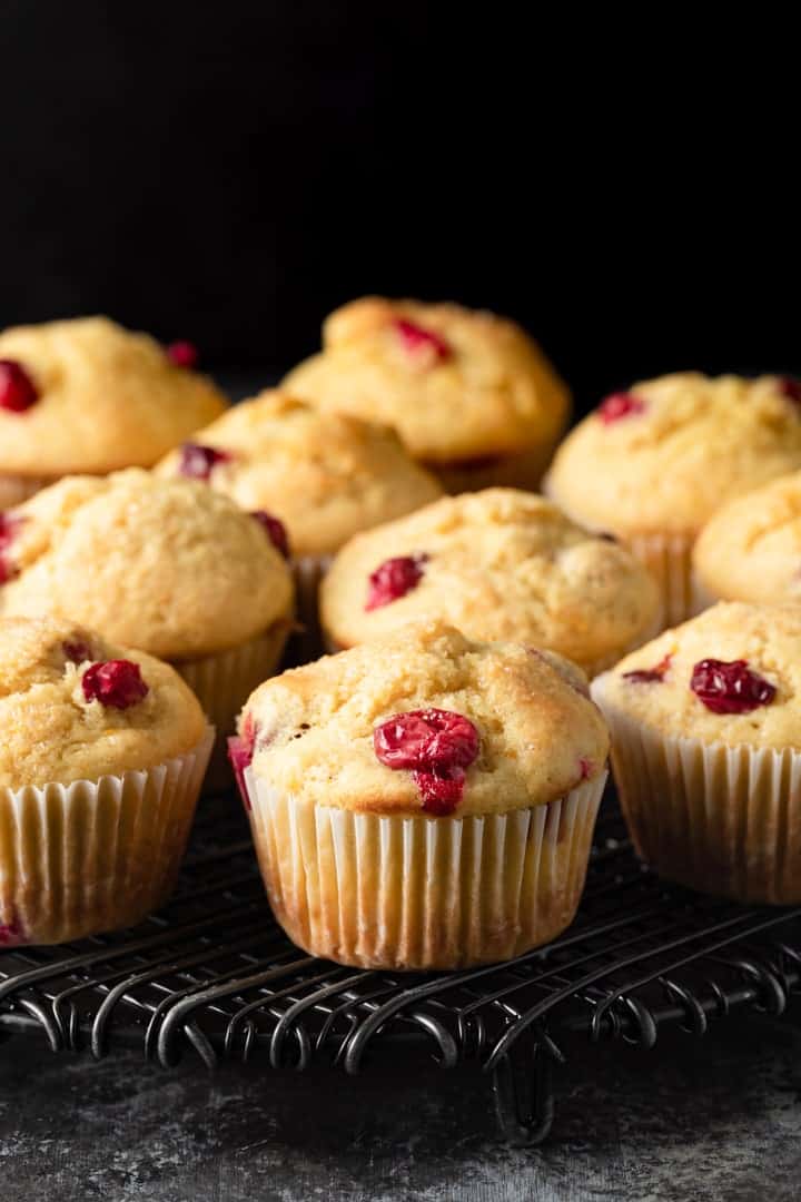 cranberry orange muffins on a cooling rack