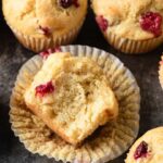 cranberry orange muffin with a bite taken out so the inside is visible