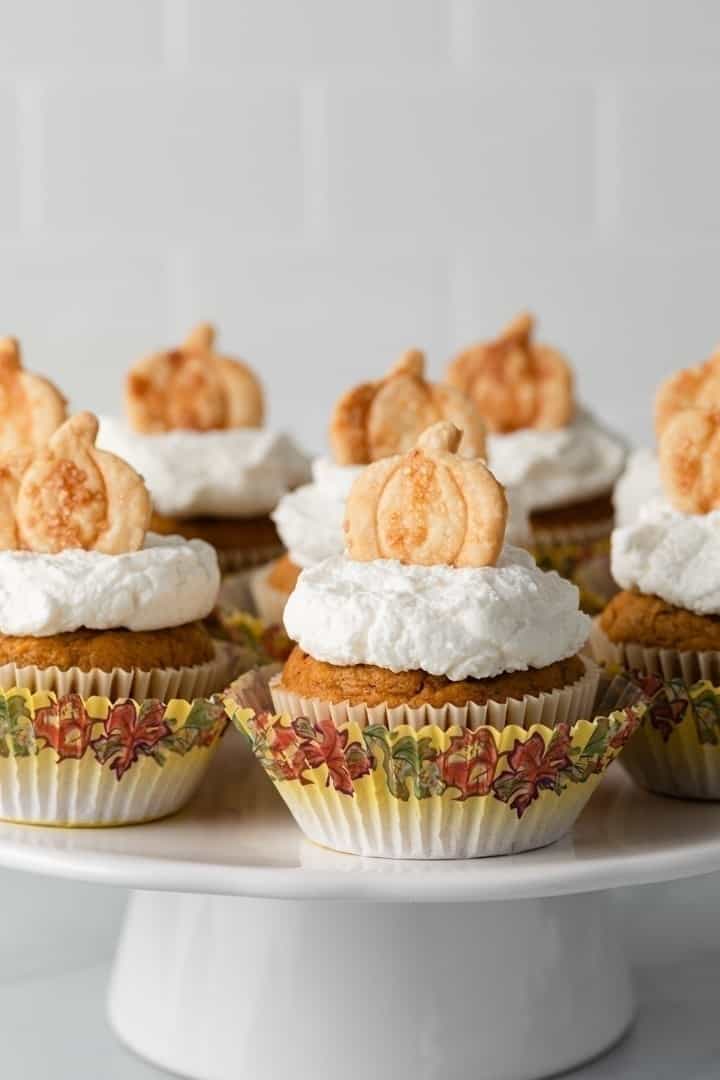 pumpkin pie cupcakes on a white cake stand