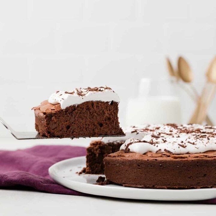 slice of flourless chocolate cake on a cake server