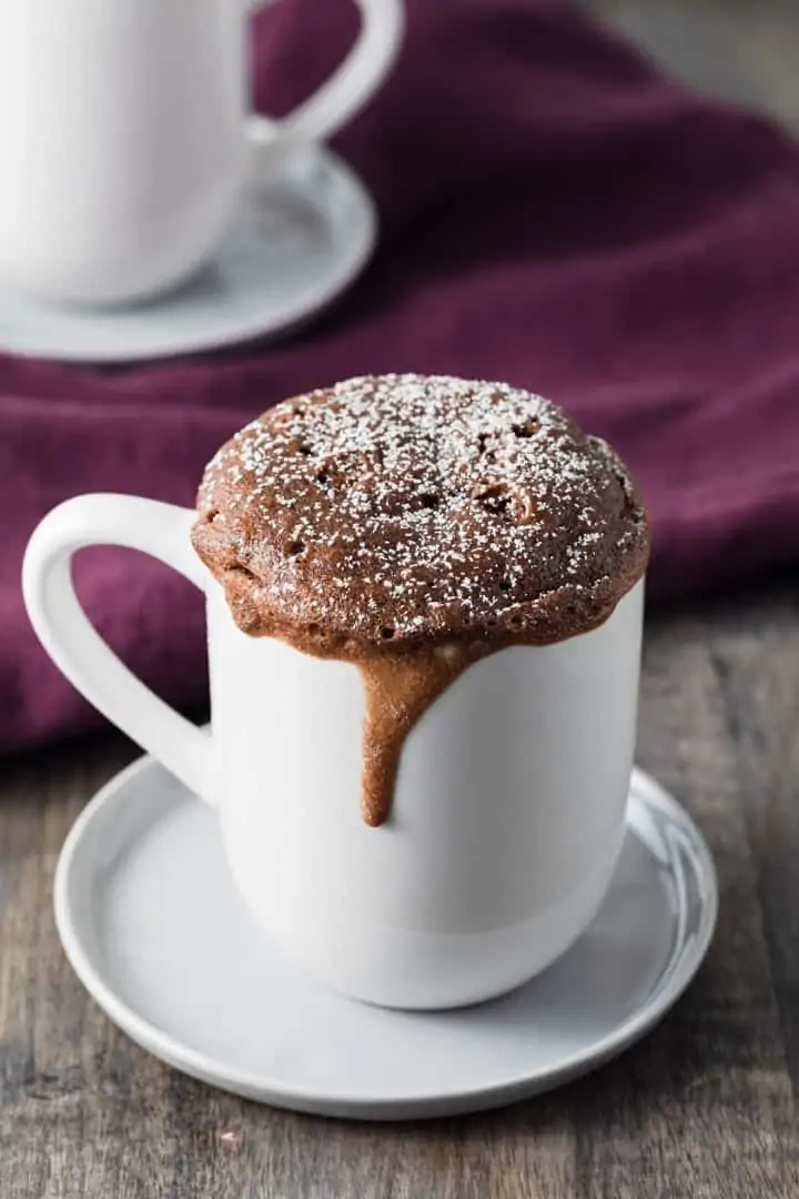 side view of Nutella mug cake in a white cup