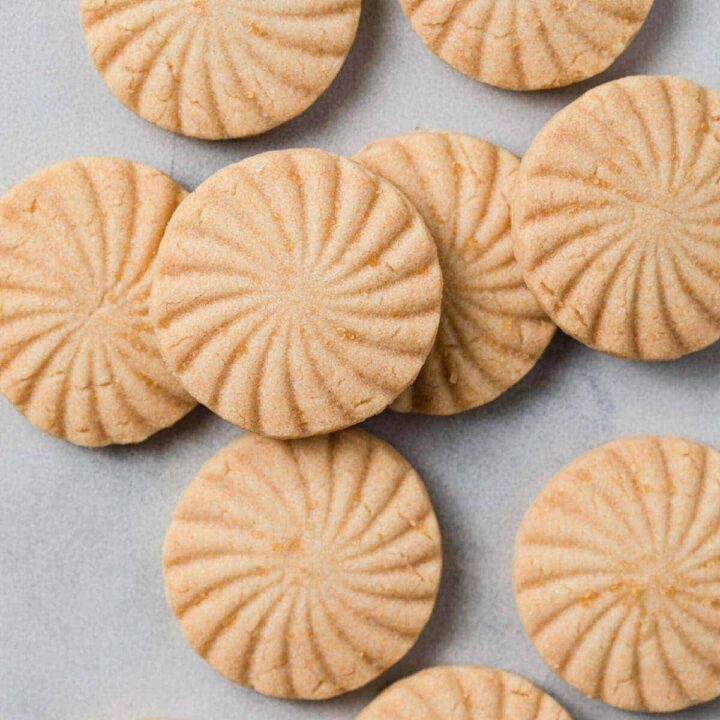 overhead of shortbread cookies scattered on tabletop