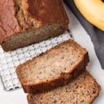 overhead of gluten free banana bread with two slices taken out