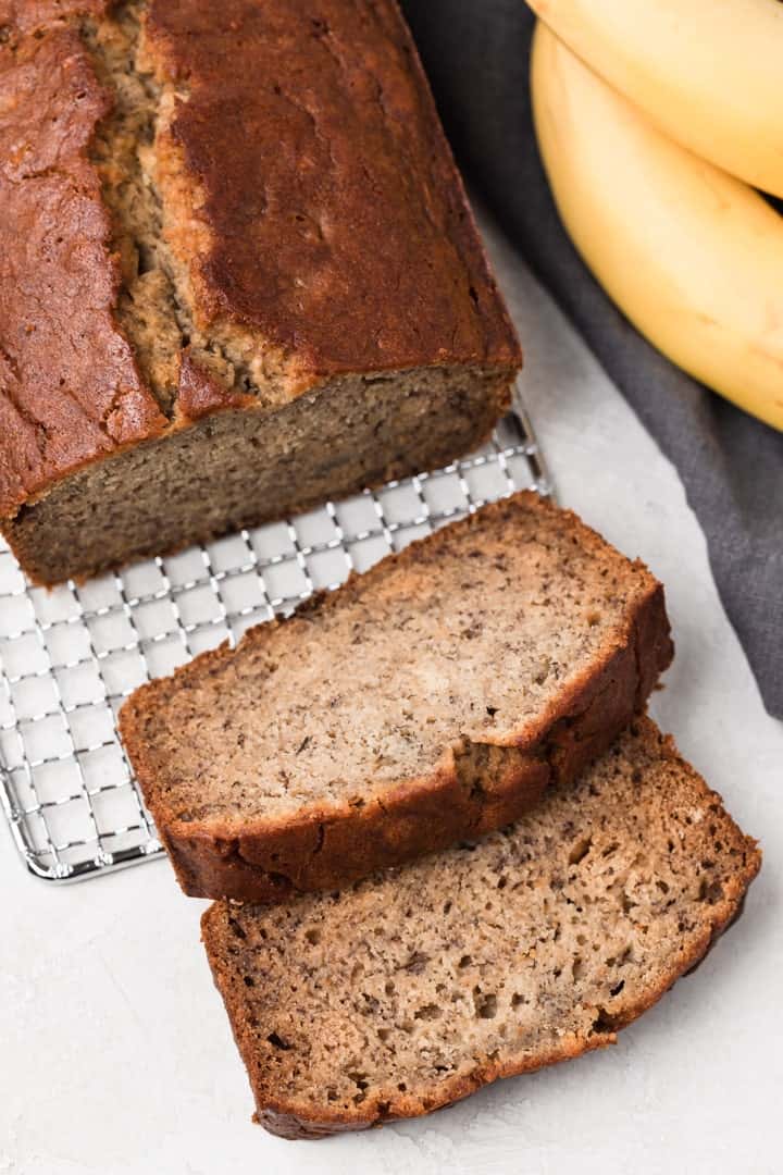 overhead of gluten free banana bread with two slices taken out