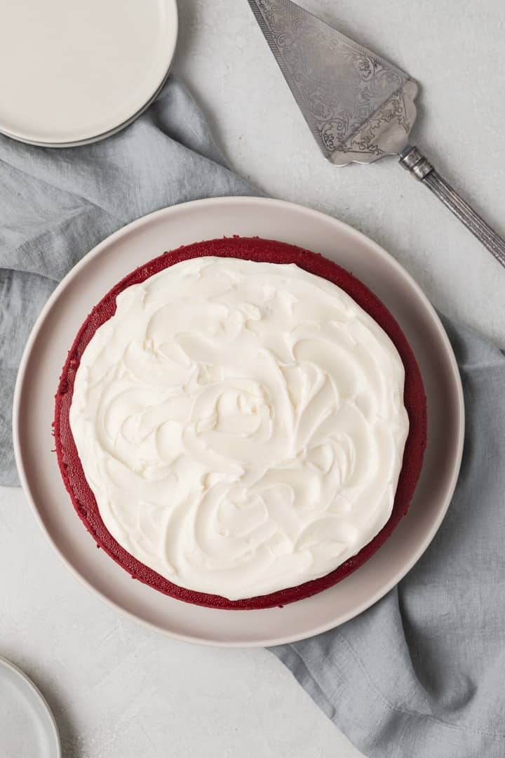 overhead view of red velvet cheesecake on a white plate