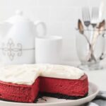 red velvet cheesecake with a slice taken out