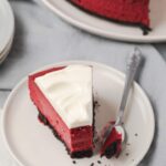 red velvet cheesecake slice with fork