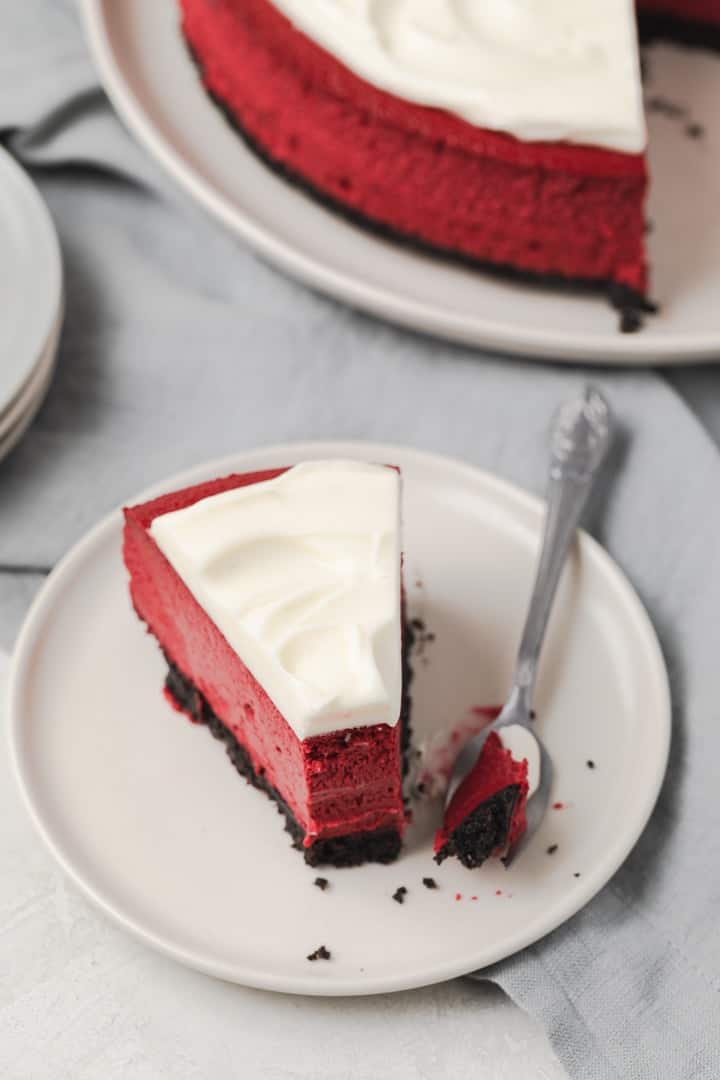 red velvet cheesecake slice with fork