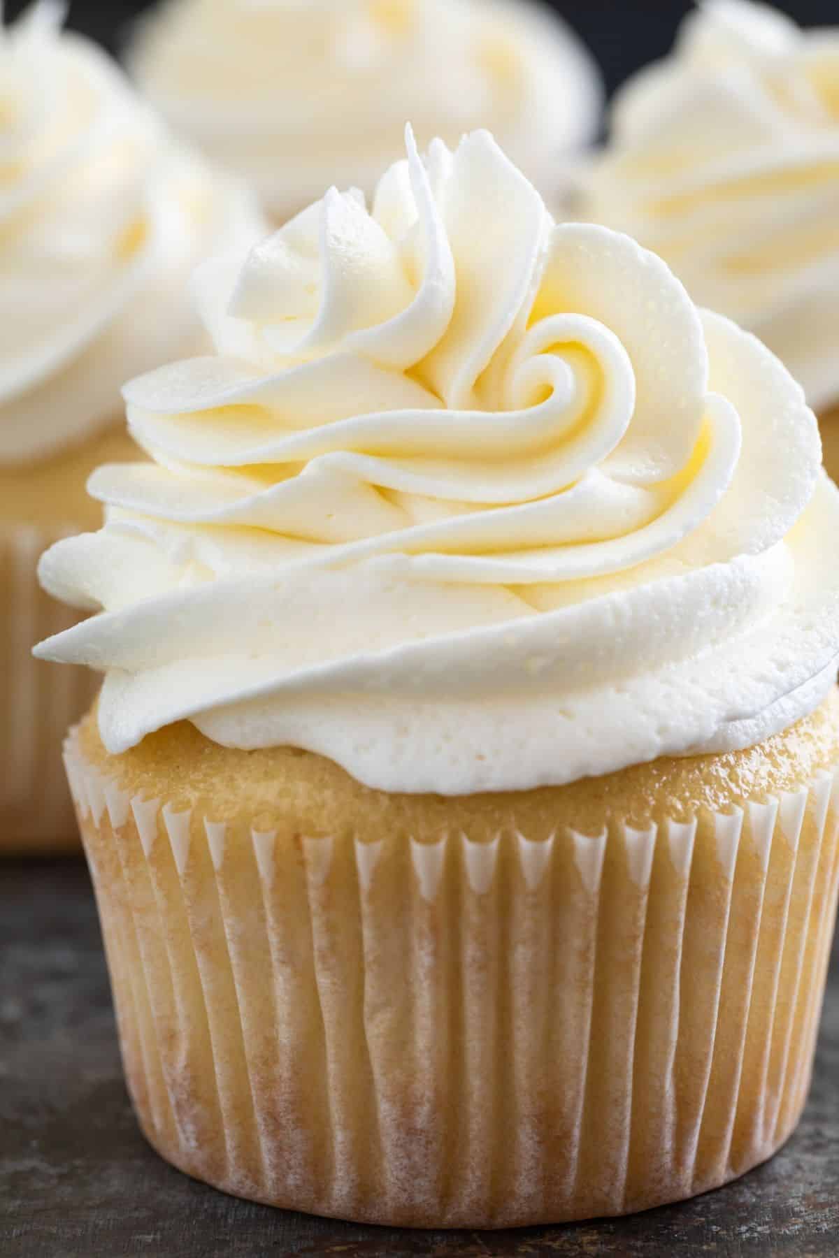 Swirl of Vanilla Buttercream Frosting on a yellow cupcake