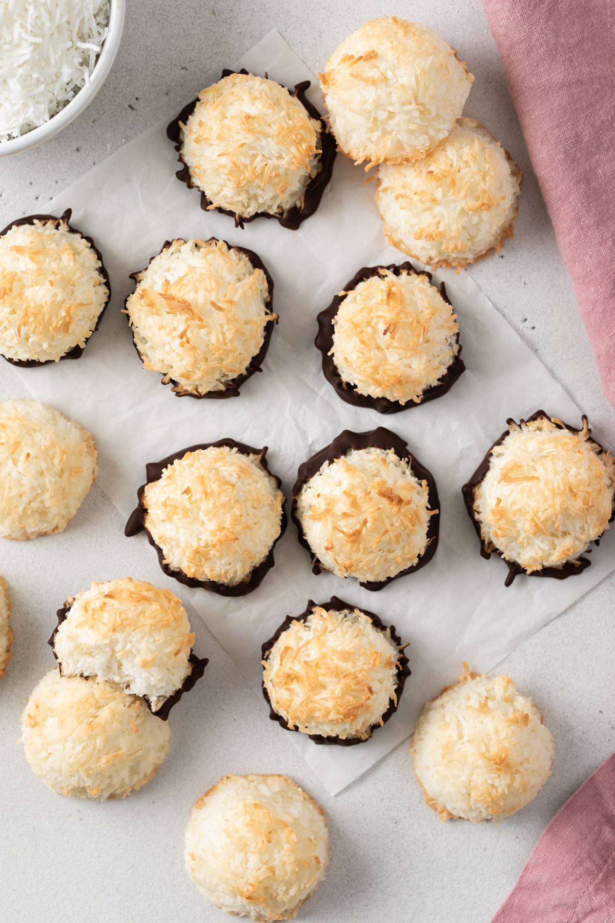 classic macaroons with chocolate bottoms on parchment paper