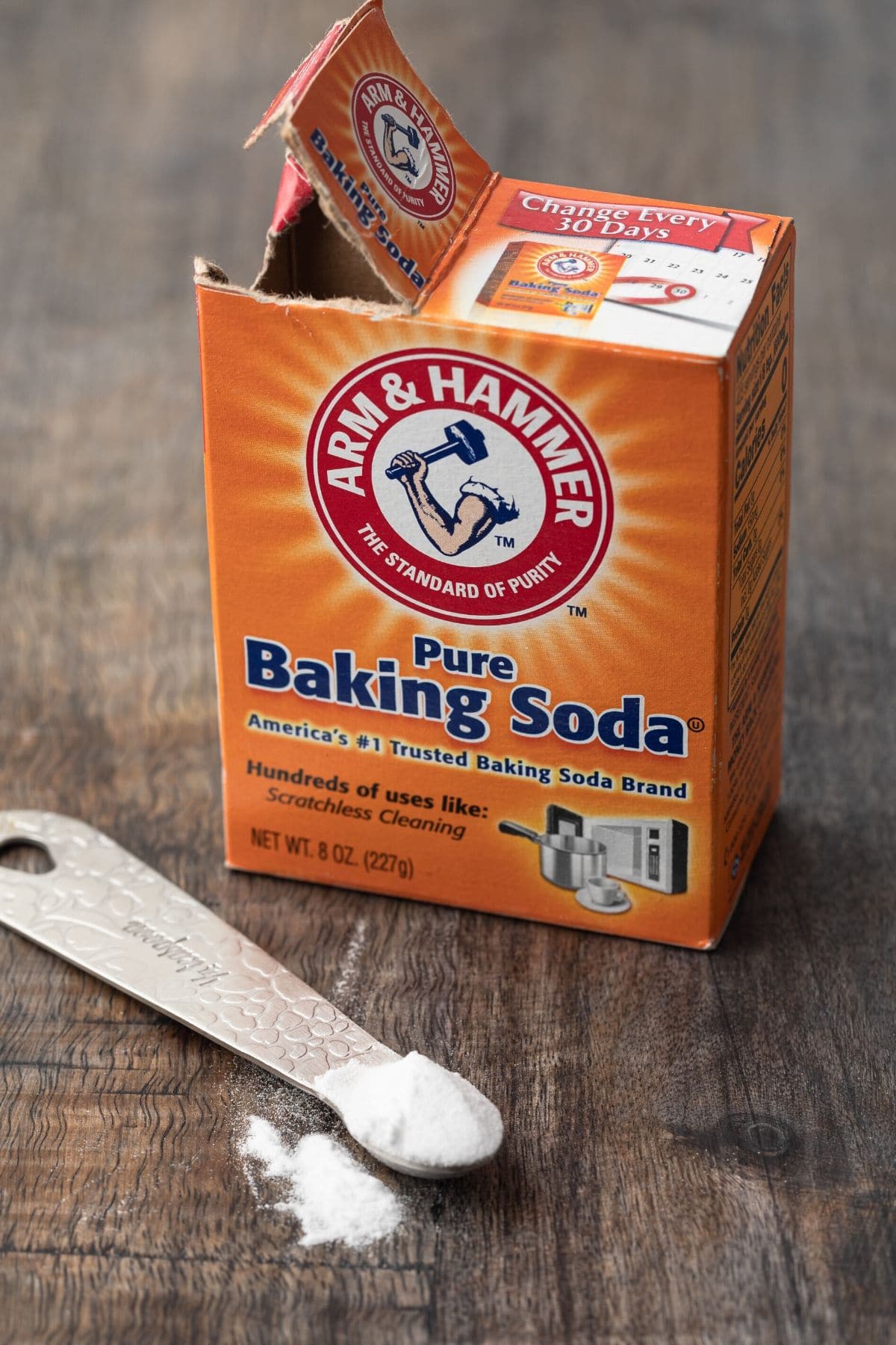 baking soda carton with teaspoon