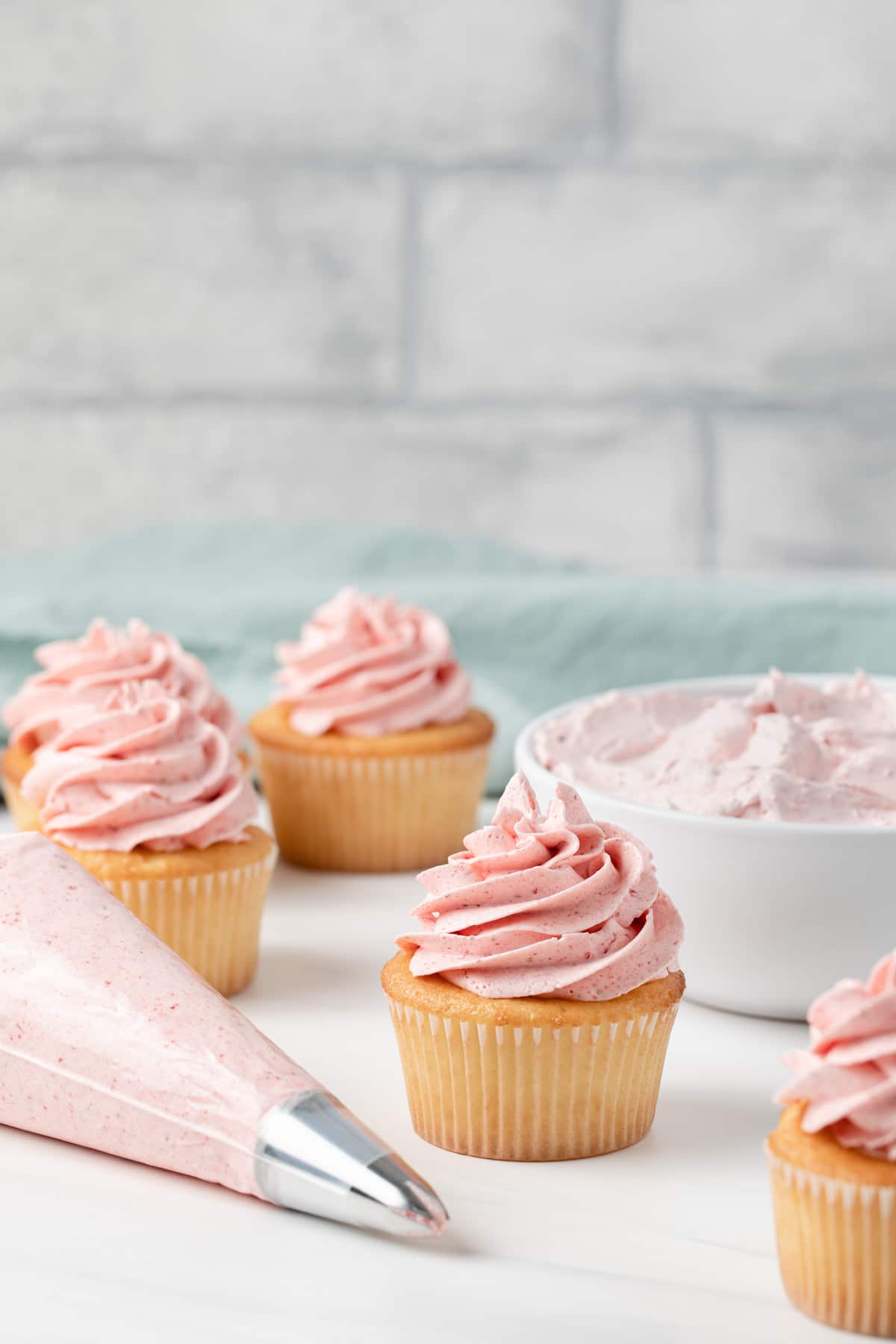 homemade strawberry frosting on cupcakes