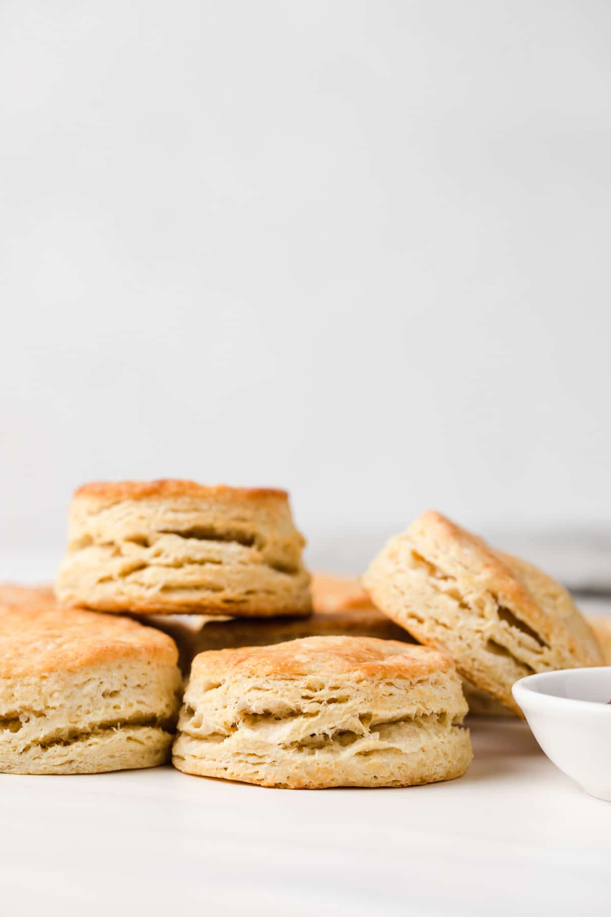 one biscuit stacked on single layer of biscuits