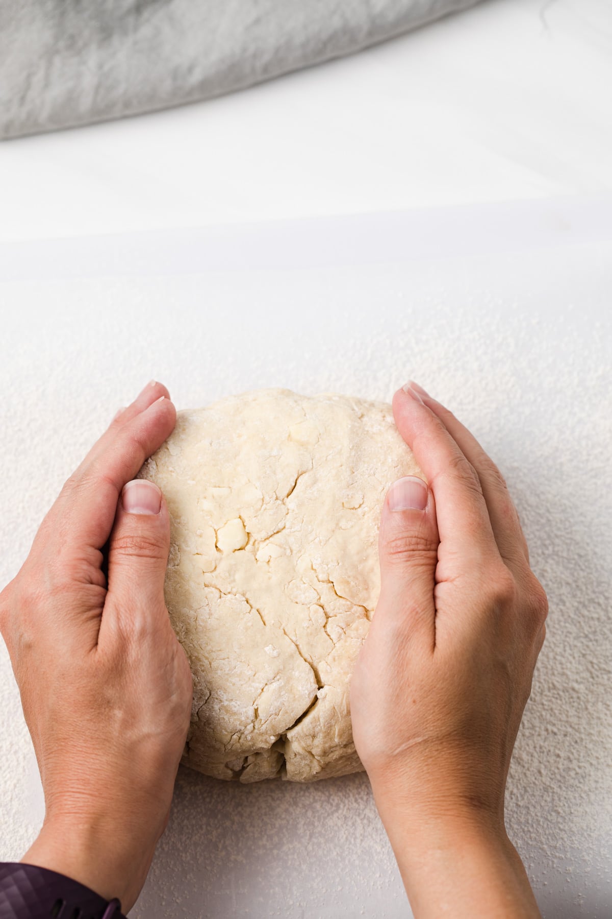 hands kneading dough