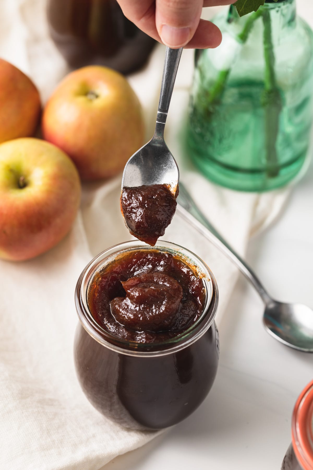 spoon dipping apple butter out of jar