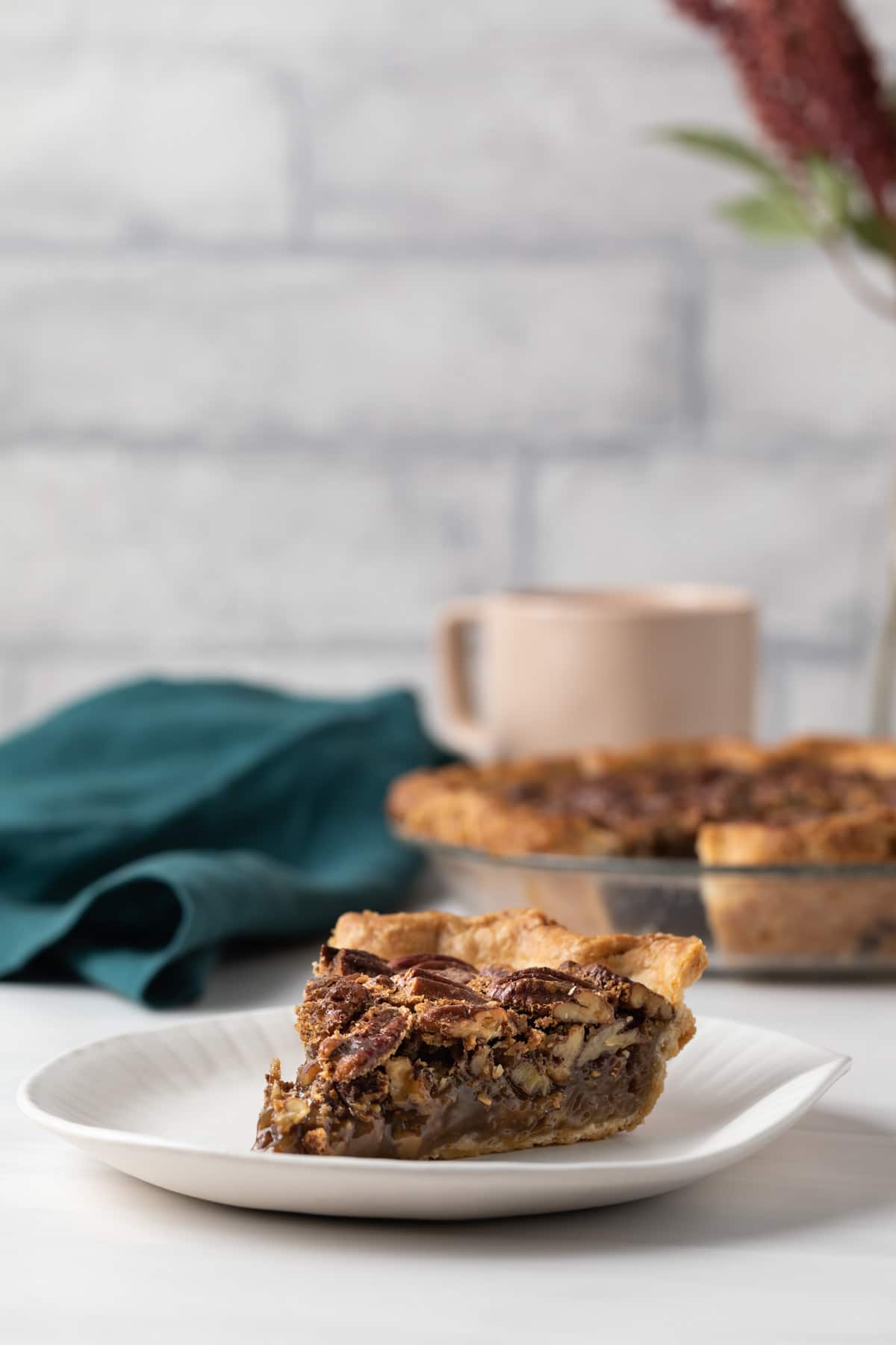 slice of pecan pie on white plate