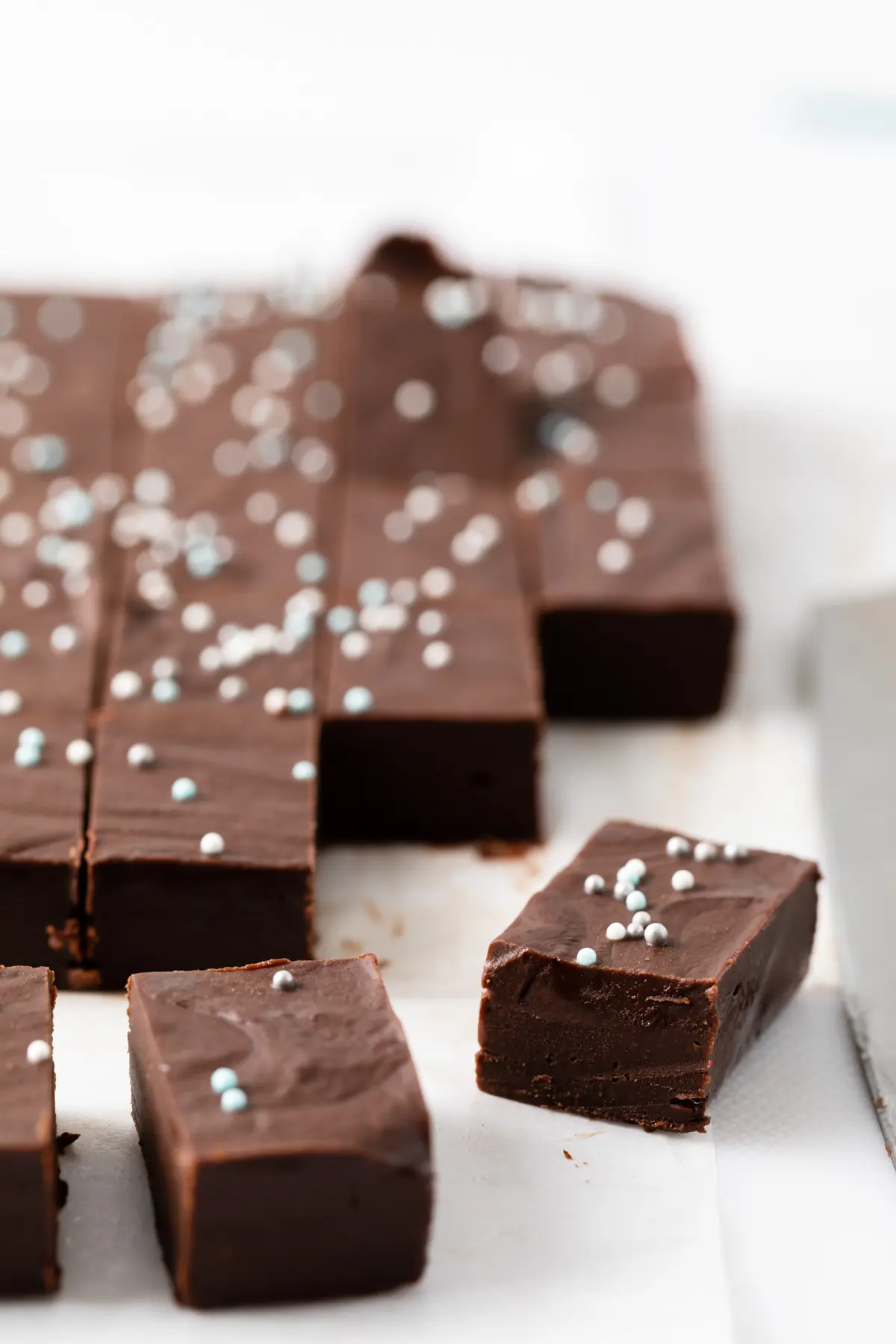 angled view of chocolate fudge with sprinkles on top