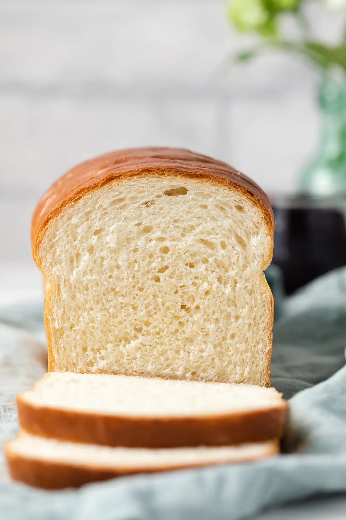 loaf of white bread with two slices cut